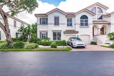 Mediterranean / spanish-style house with decorative driveway, an attached garage, stucco siding, and a tile roof