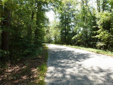 Located on nice paved road with Mature shade trees.