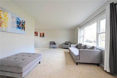 Spacious front living room has been freshly painte