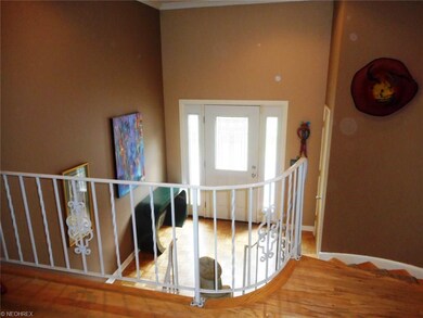 This wide and welcoming foyer separates two living