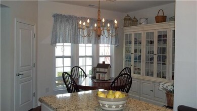 Eat-in kitchen has plenty of room for a large table.  Window provides lots of sunlight as you enjoy your meals at the table.