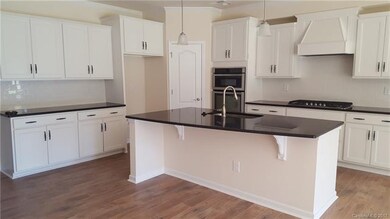 Example of Gourmet Kitchen with granite countertop