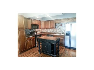 KITCHEN ALSO FEATURES AN ISLAND
