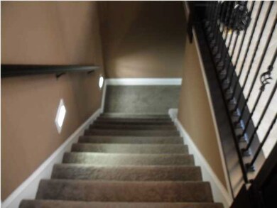 Stairway to the basement features stairwell lighti