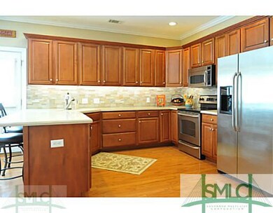 Kitchen. The stylish kitchen features cherry cabin