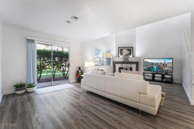 Living room featuring dark wood-type flooring, bas