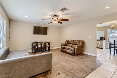Spacious living room with laminate flooring & ceil