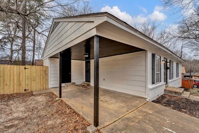 Exterior space featuring a carport