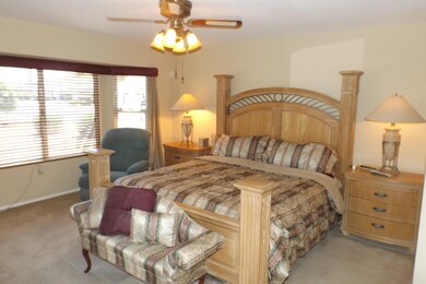 MASTER SUITE FEATURES BAY WINDOW, DOORWAY TO REAR PATIO, VANITY, HI-RISE COMMODE & STEP IN SHOWER.