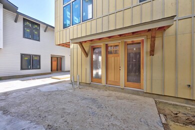 View of exterior entry with board and batten sidi