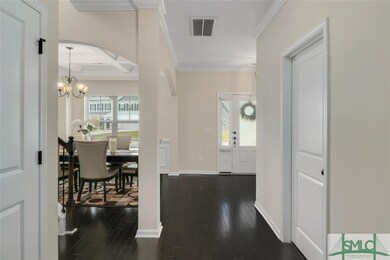 Wide, welcoming foyer open to formal dining room /