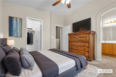 Dual Primaries. Bedroom featuring a sink, a closet