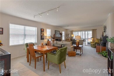 Open dining / living area with view to porch and outside