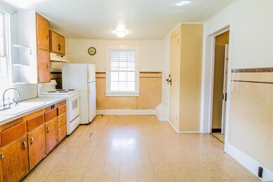 Eat-in kitchen. Stove and refrigerator stay.