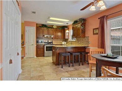 Beautiful custom kitchen with granite and glass ba