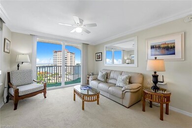 Carpeted living room featuring crown molding and c