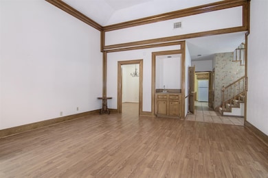 Additional view of the den showing wet bar.