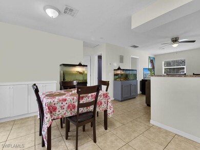 Dining area with light tile patterned flooring and