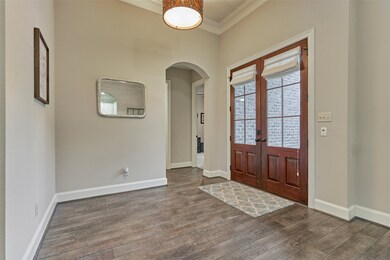 To the right of the foyer are two secondary bedrooms and a full bath.