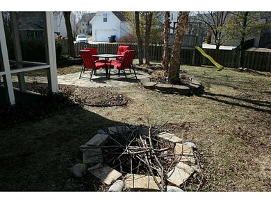 Yard. This yard has it all-screened porch, patio, 2 playsets, beautiful landscaping, a fence, and a firepit to top it off!