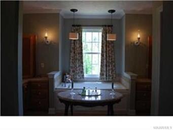 Elegant Master bath with double vanities, jetted g