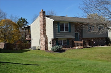 View of covered back porch and fenced in yard