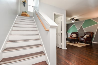 FOYER LEADS TO FLEX ROOM AND HALF BATH TO RIGHT AN