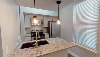 Kitchen featuring appliances with stainless steel