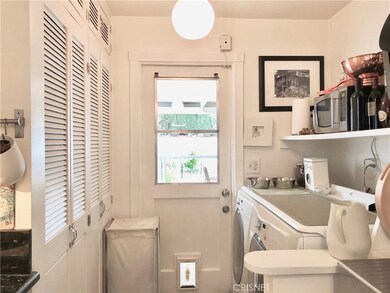 Laundry area off kitchen.