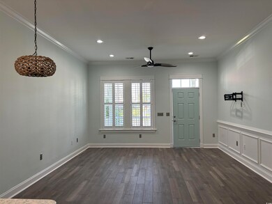 Foyer entrance with dark wood-type flooring, ceili