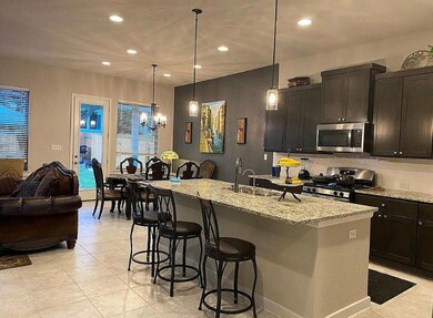 Kitchen featuring appliances with stainless steel