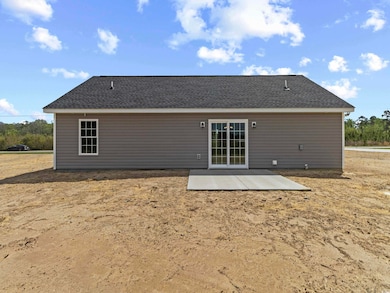 Rear view of property with a patio
