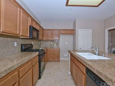 Abundant cabinetry with granite counter tops, deep