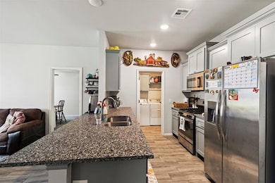Kitchen with appliances with stainless steel finis