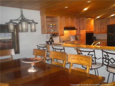 Dining Room. lined with windows; opening out on to