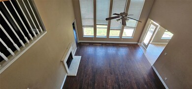 Unfurnished living room with hardwood / wood-style