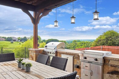 View of patio / terrace with a wooden deck, an out