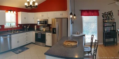 Vaulted ceiling and updated ceiling fan.