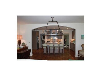 The gourmet kitchen adjoins the great room through