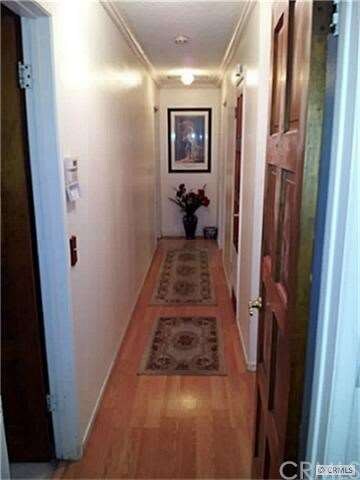 THE HALLWAY IS WELL LIT AND CLEAN.