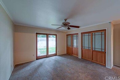 Large master bedroom with custom closet doors and 