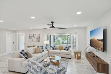 Living area with light marble finish flooring, rec