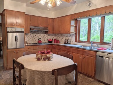 Kitchen   Window has remote shade at this large wi