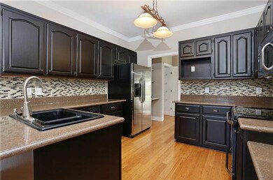 Kitchen features new glass back splash and new appliance package.