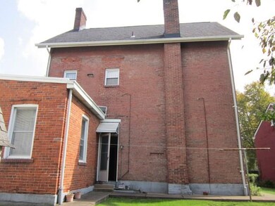 Rear view of the building.  Open door is an entran