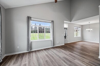 The vaulted ceilings, new baseboards and new vinyl plank flooring enhance the already spacious layout
