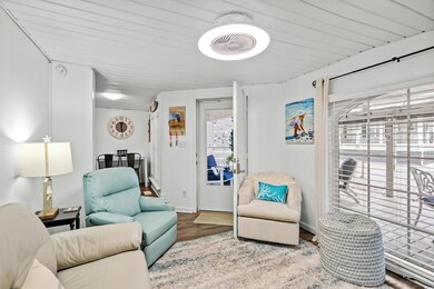Living room with wood-type flooring