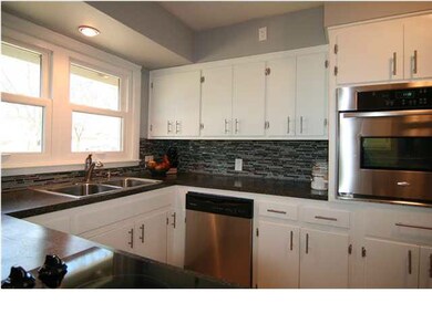 Gorgeous updated kitchen. Glass tile backsplash. N