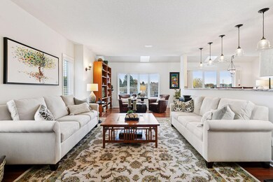 Another angle of the living space where there are various options for seating and decor.