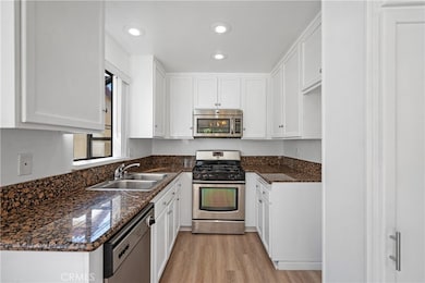 Kitchen with stainless steel appliances, and Granite counters